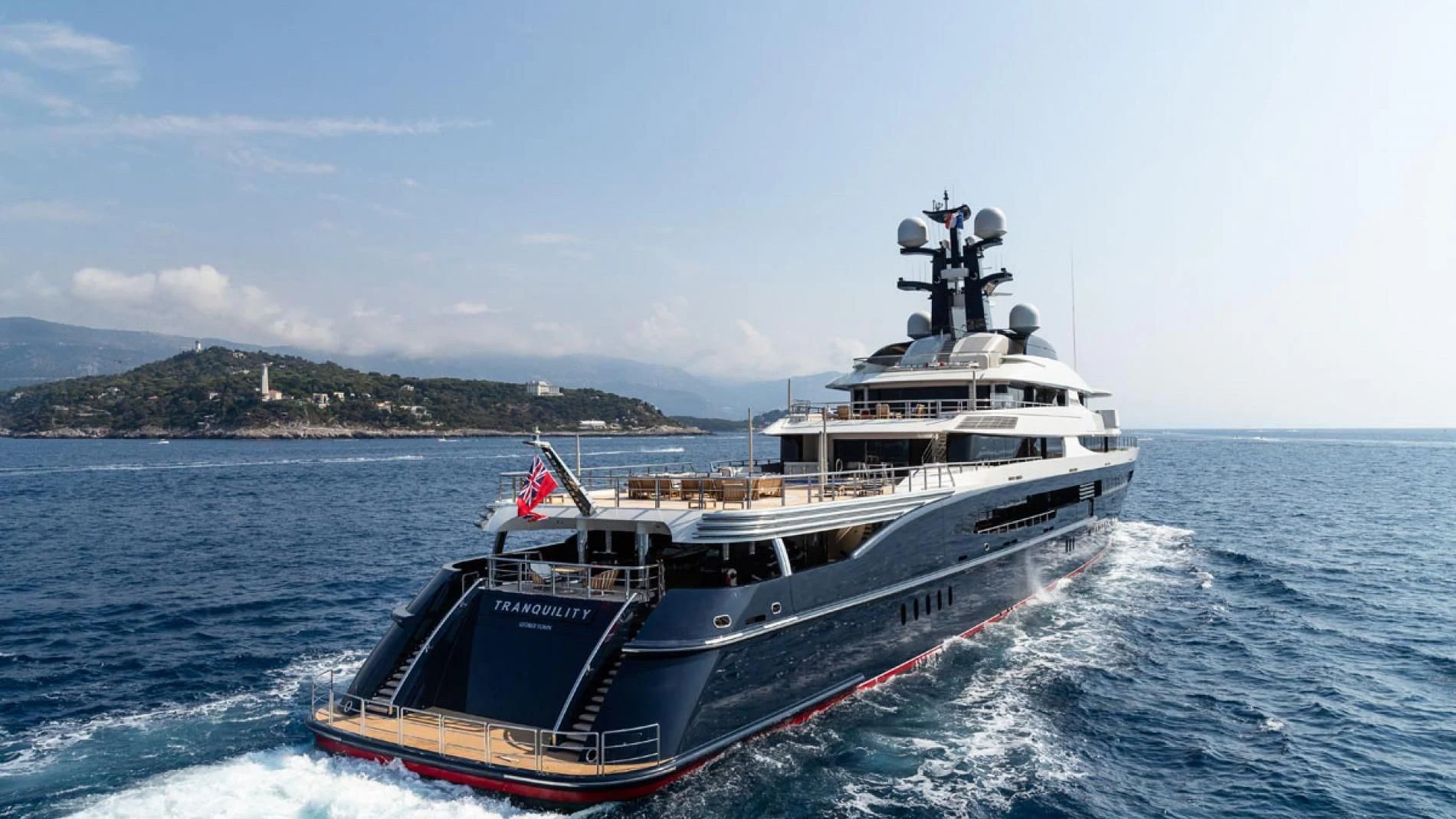 a large boat on the water aboard DRAAK Yacht for Sale