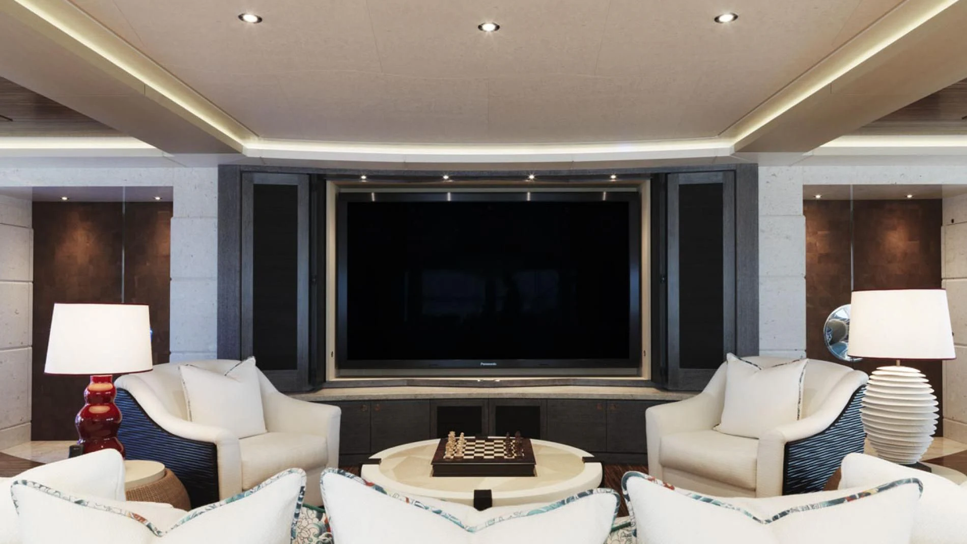 a living room with a large television aboard DRAAK Yacht for Sale