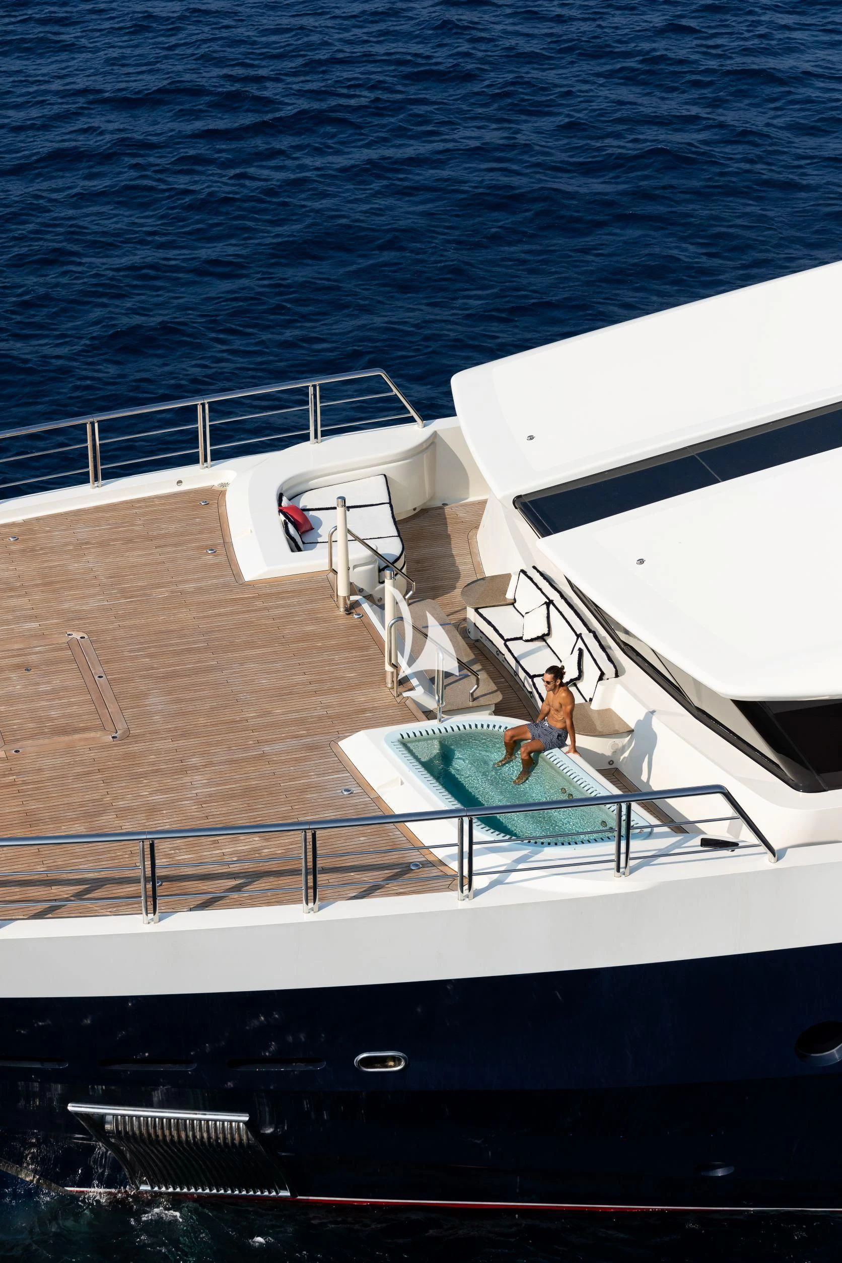 a man and a woman on a boat aboard DRAAK Yacht for Sale