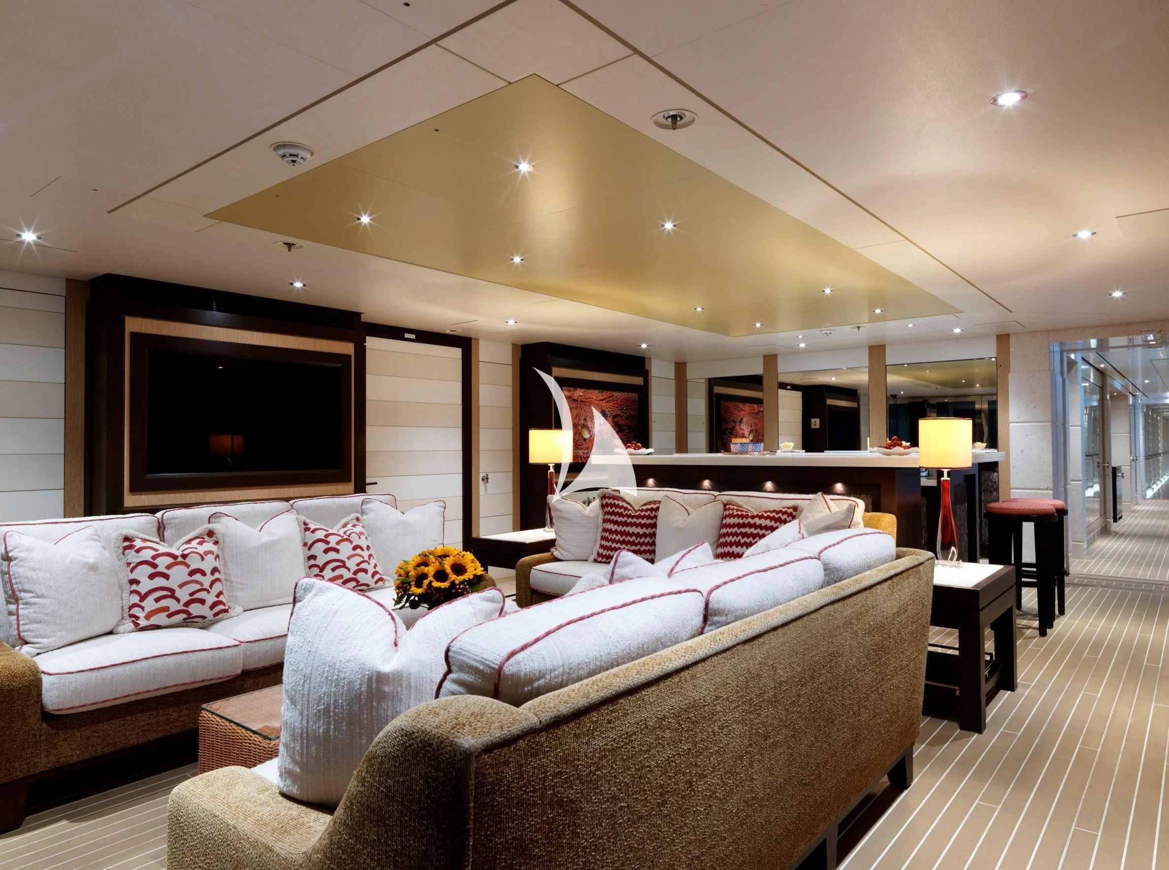 a large living room with a large bed and a tv aboard DRAAK Yacht for Sale