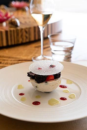 a dessert on a plate aboard DRAAK Yacht for Sale