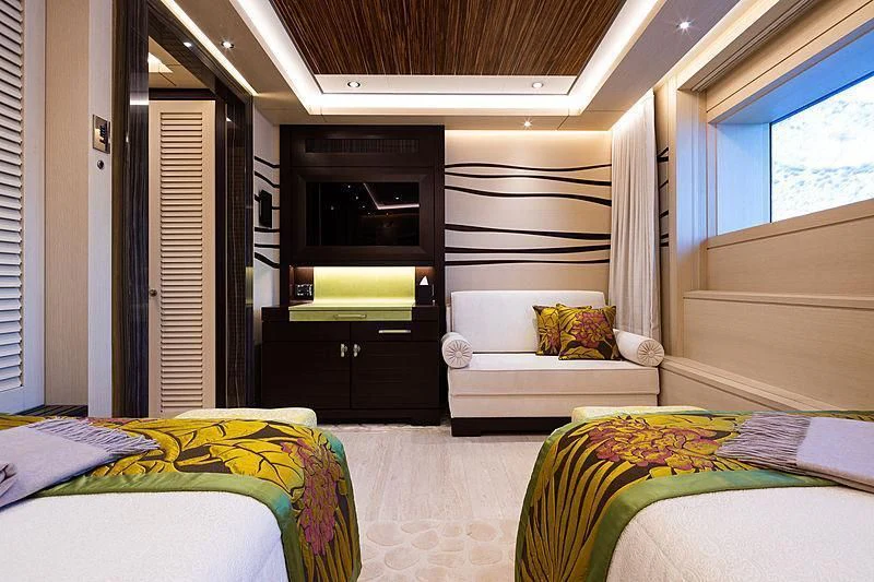 a room with a bed and a tv aboard DRAAK Yacht for Sale