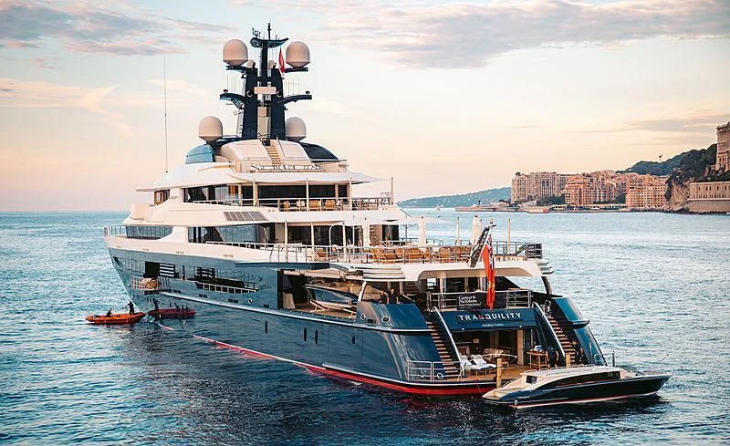 a large boat in the water aboard DRAAK Yacht for Sale