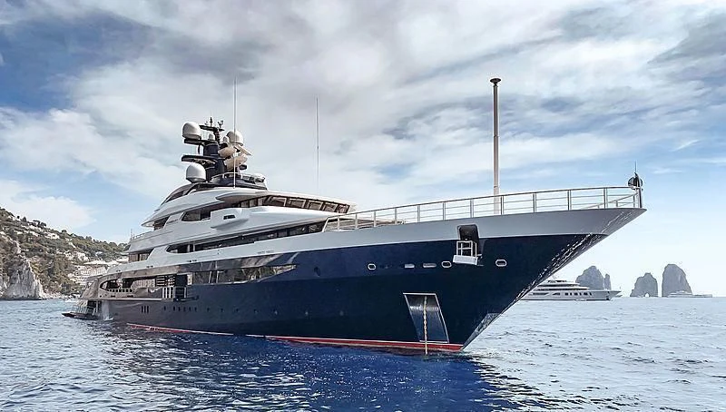 a large ship in the water aboard DRAAK Yacht for Sale