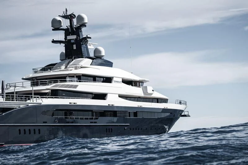 a large white ship in the water aboard DRAAK Yacht for Sale