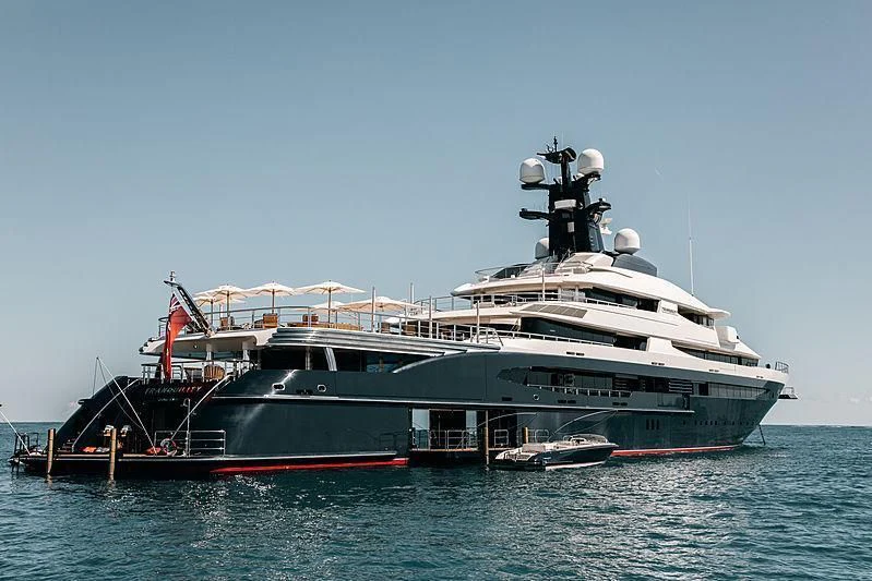 a large boat in the water aboard DRAAK Yacht for Sale