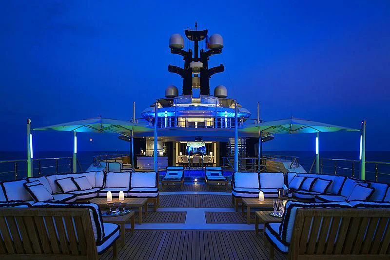 a large blue ship docked aboard DRAAK Yacht for Sale