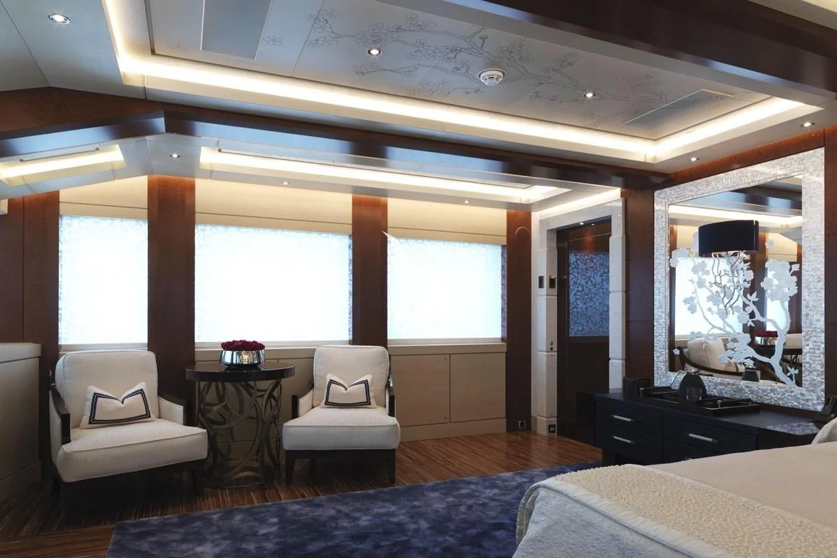 a room with a bed and a desk aboard DRAAK Yacht for Sale