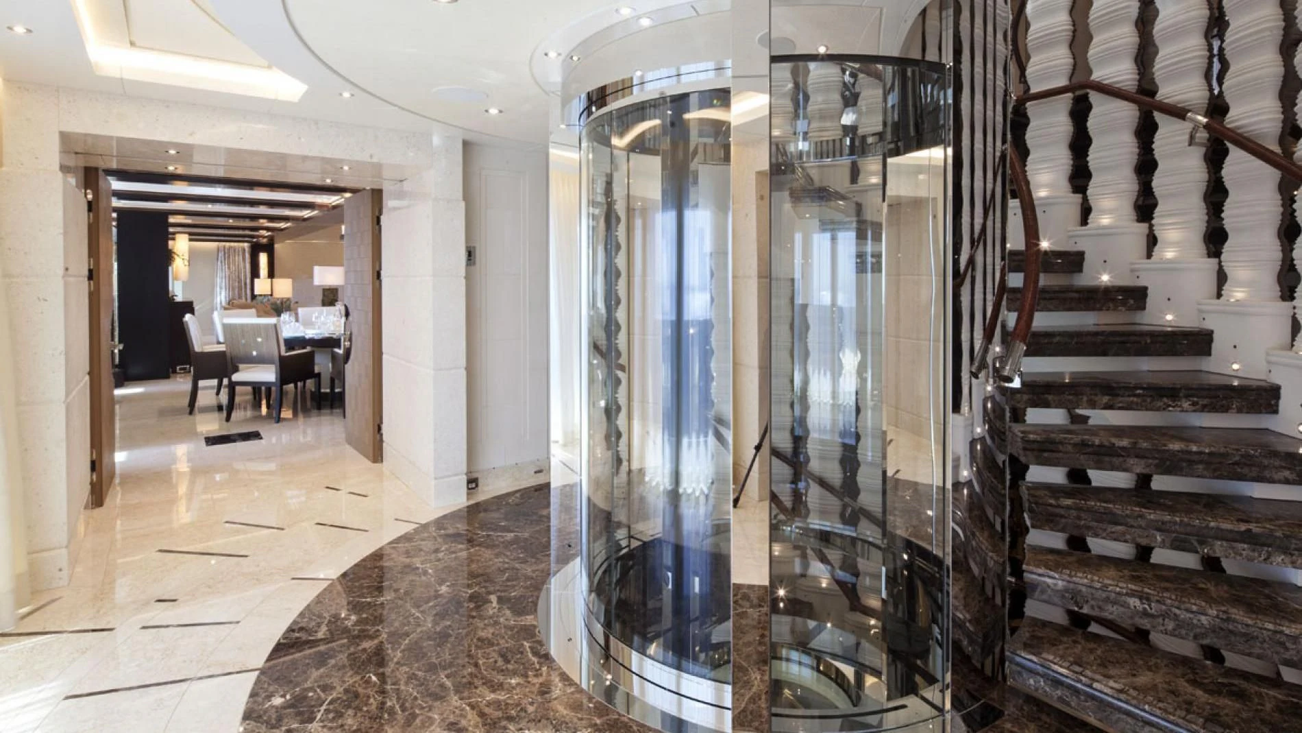 a large room with glass walls aboard DRAAK Yacht for Sale