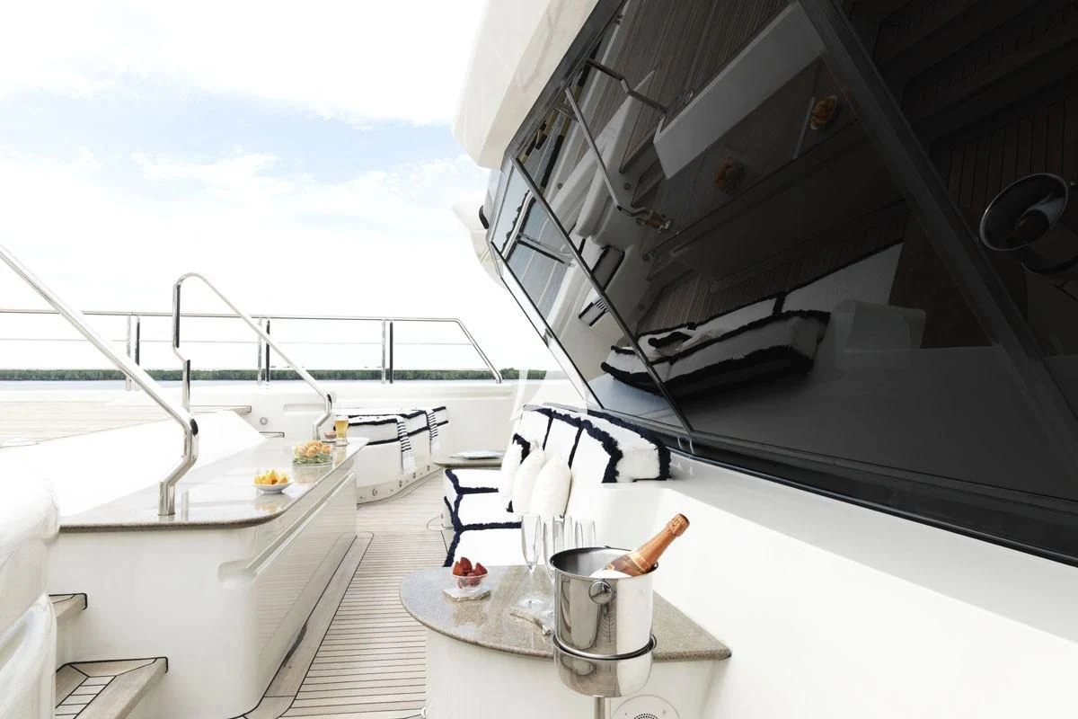 a boat with a grill and a table on it aboard DRAAK Yacht for Sale