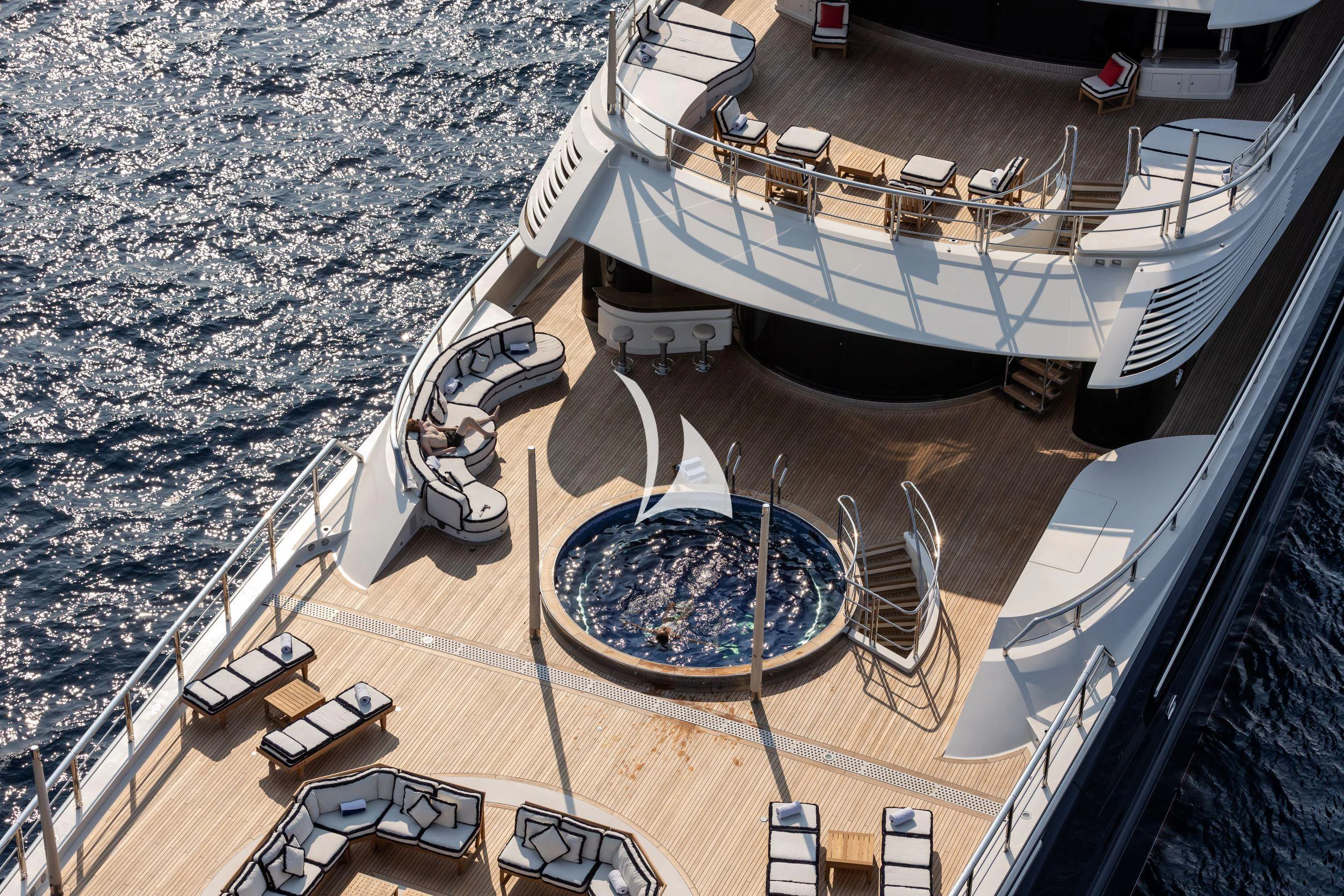 a large ship docked at a port aboard DRAAK Yacht for Sale