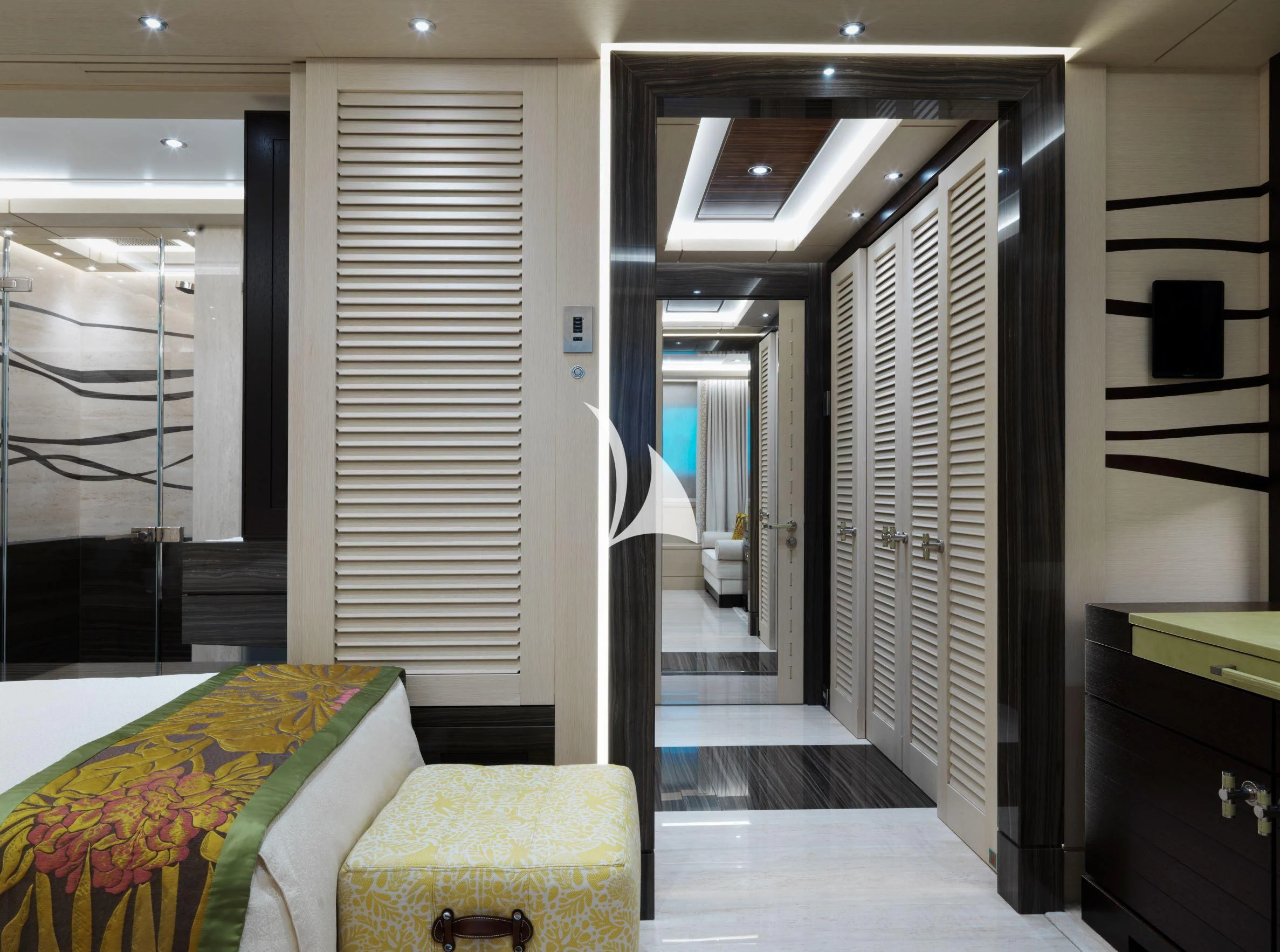 a room with a bed and a mirror aboard DRAAK Yacht for Sale