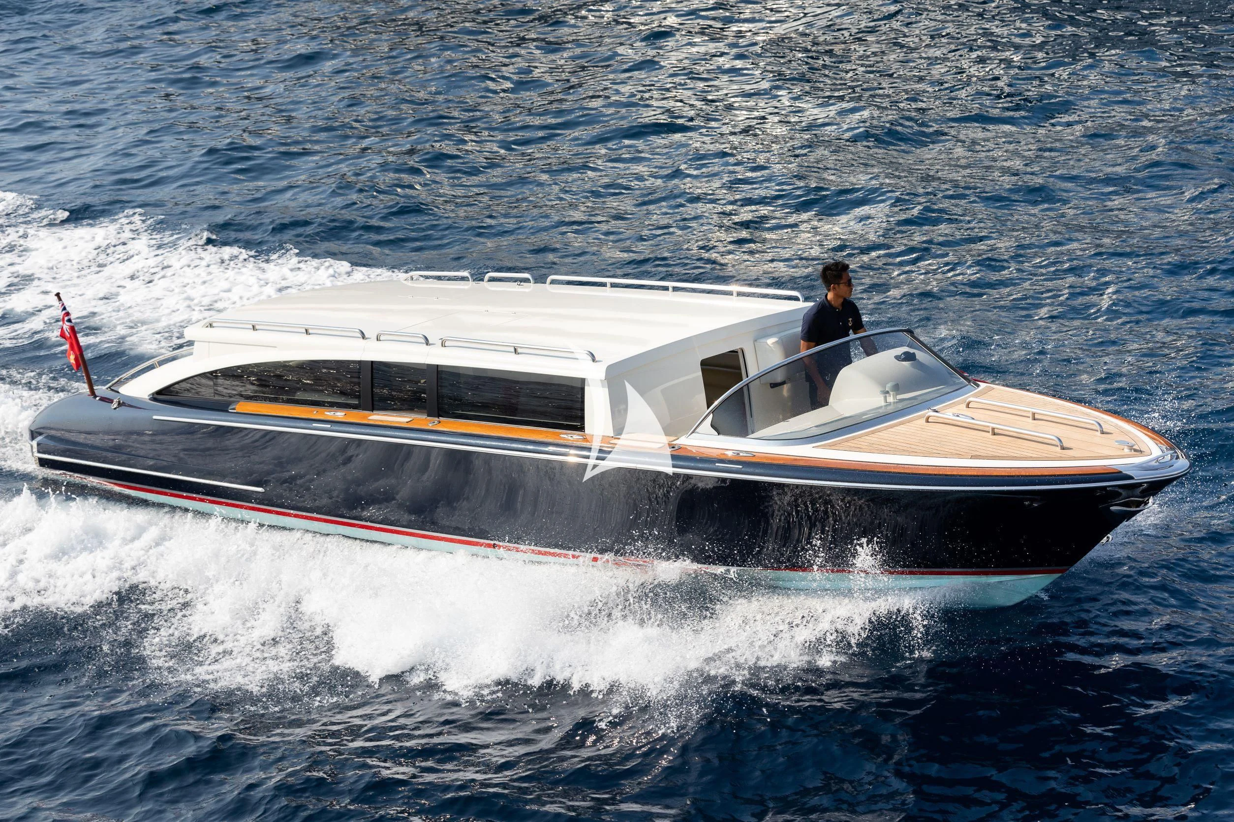 a man on a boat aboard DRAAK Yacht for Sale