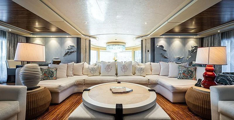 a living room with a large white couch and a large white sofa aboard DRAAK Yacht for Sale