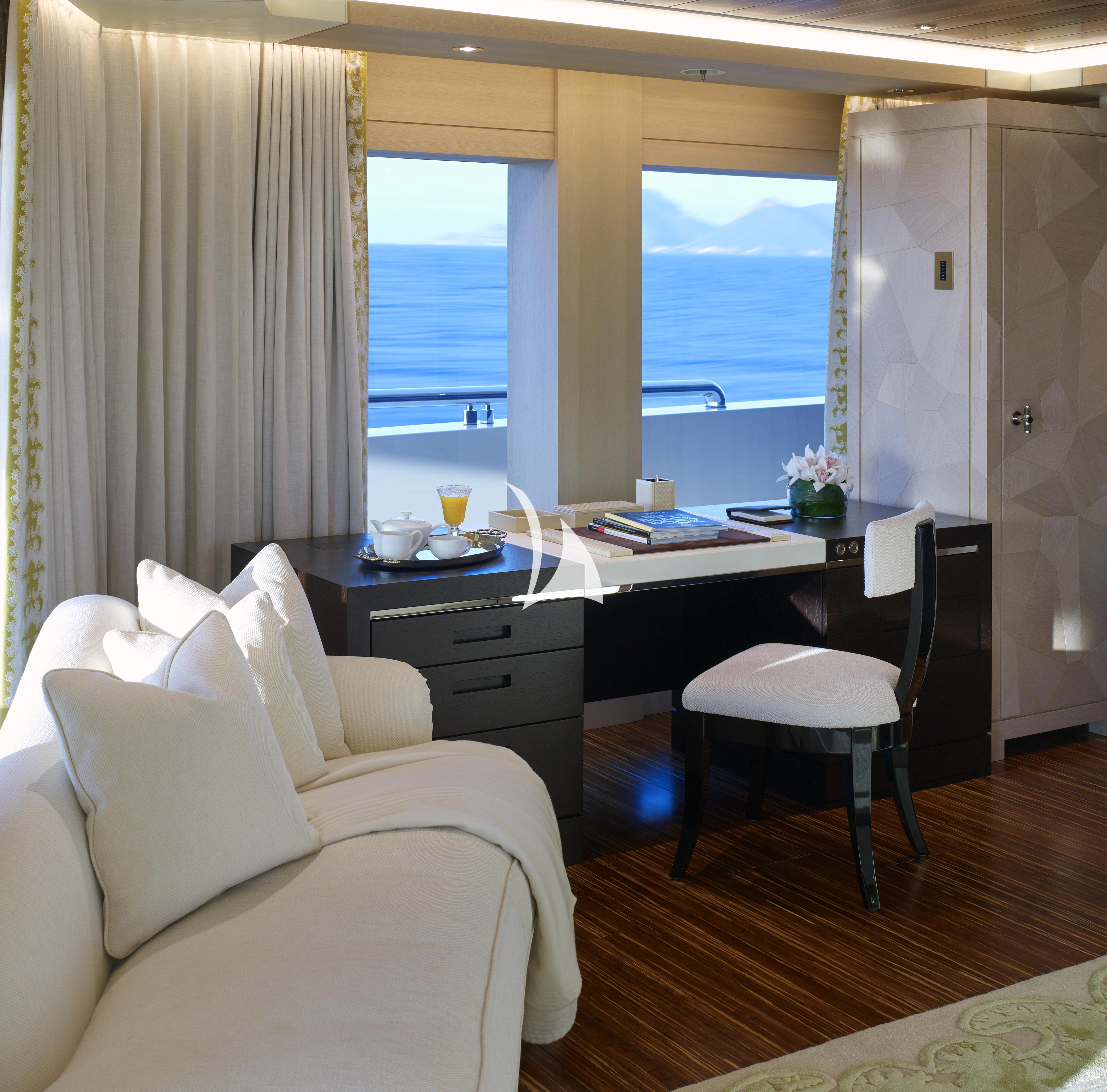 a room with a desk and a window aboard DRAAK Yacht for Sale
