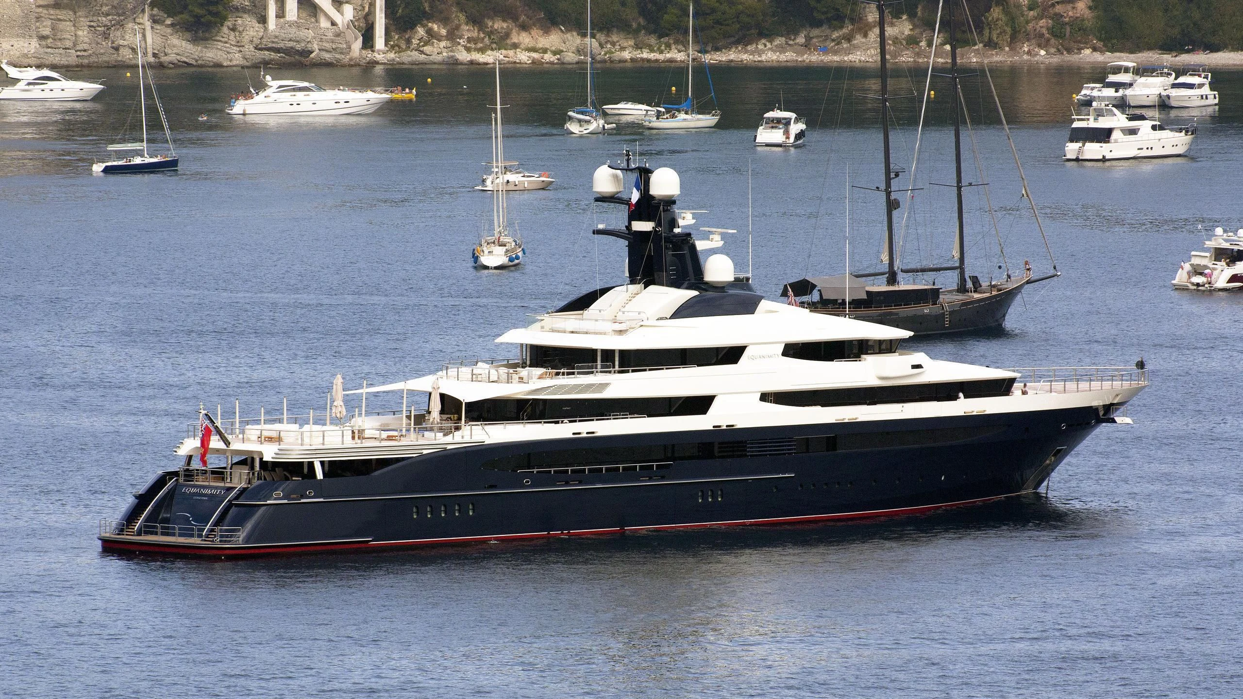 a large boat in the water aboard DRAAK Yacht for Sale