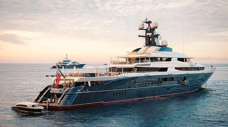 a large boat in the water aboard DRAAK Yacht for Sale