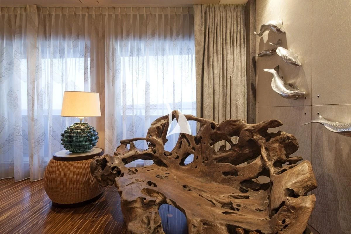 a wooden sculpture of a dinosaur aboard DRAAK Yacht for Sale