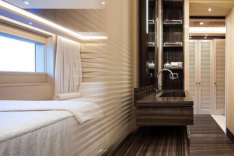 a room with a bed and a sink aboard DRAAK Yacht for Sale