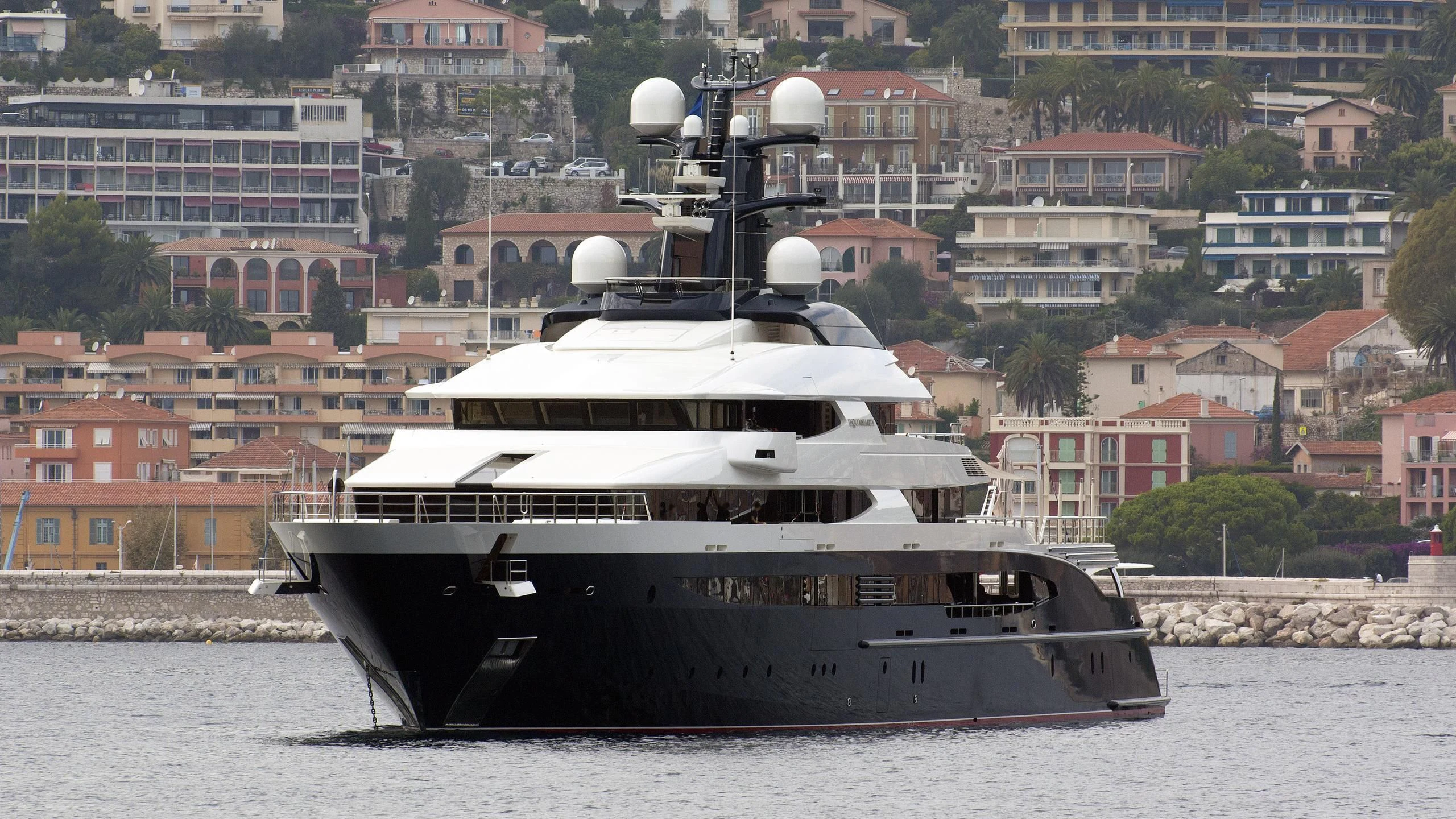 a large boat in the water aboard DRAAK Yacht for Sale
