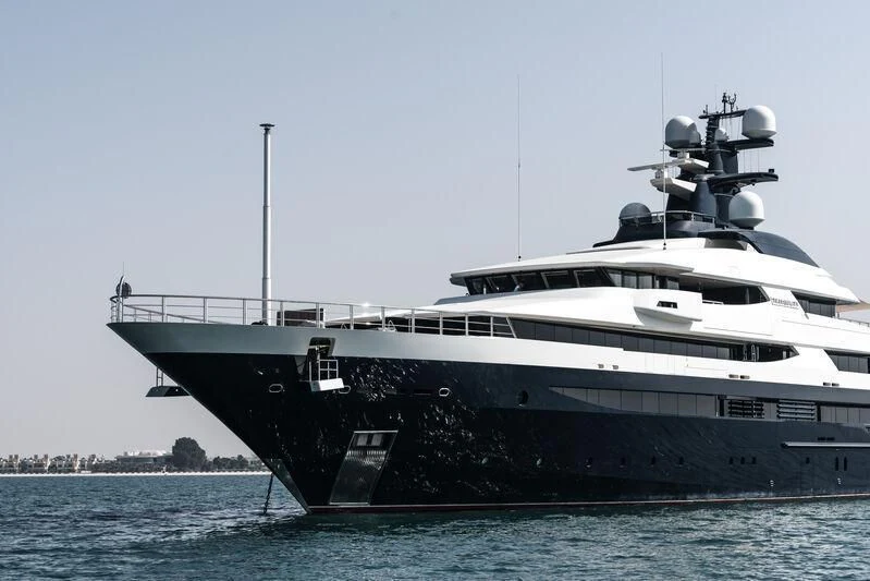 a large white boat in the water aboard DRAAK Yacht for Sale