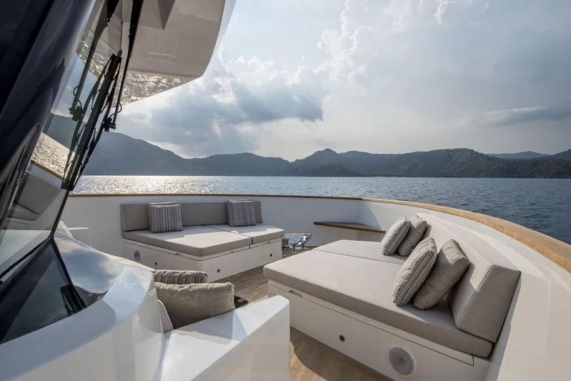a room with a bed and a view of the ocean aboard LADY STEFANI Yacht for Sale