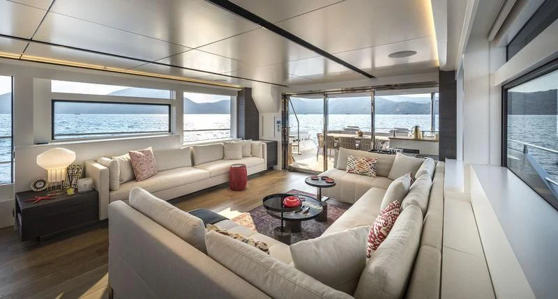 a living room with a large window aboard LADY STEFANI Yacht for Sale