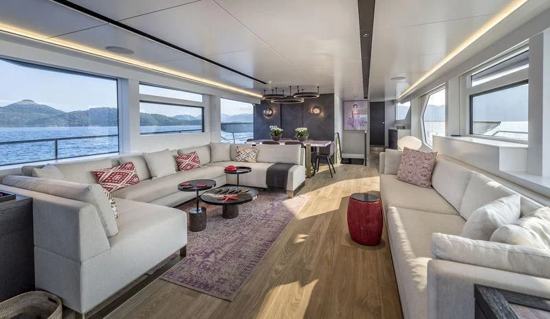 a living room with a large window aboard LADY STEFANI Yacht for Sale