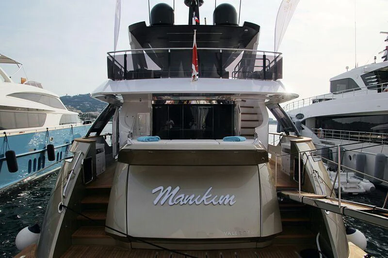a boat on a dock aboard MANIKIM Yacht for Sale