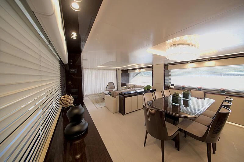 a room with a table and chairs aboard MANIKIM Yacht for Sale