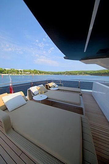 a deck with a view of the water and land aboard MANIKIM Yacht for Sale