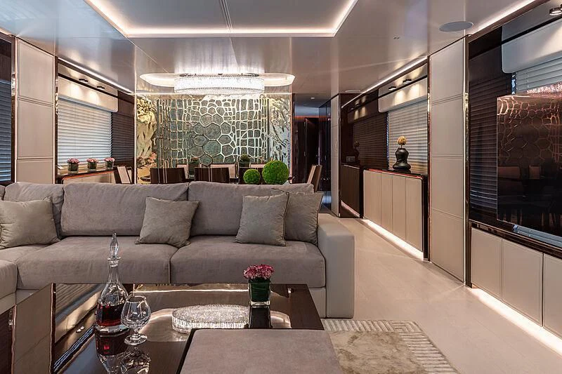 a living room with a couch and a coffee table aboard MANIKIM Yacht for Sale