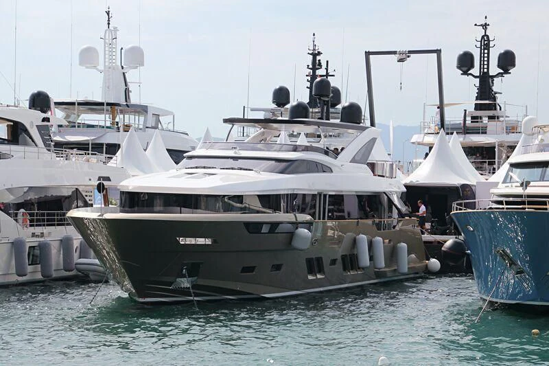 a group of boats are parked in a harbor aboard MANIKIM Yacht for Sale