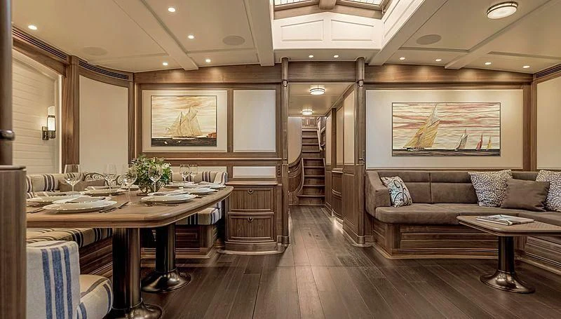 a living room with a wood floor aboard SVEA Yacht for Sale