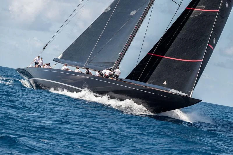 a group of people sailing on a sailboat aboard SVEA Yacht for Sale