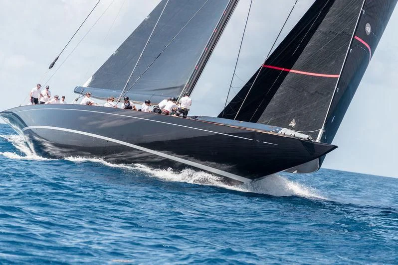 a sailboat with people on it aboard SVEA Yacht for Sale