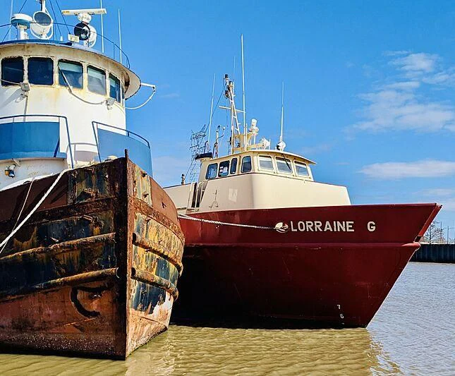 two boats docked at a pier aboard LORRAINE Yacht for Sale