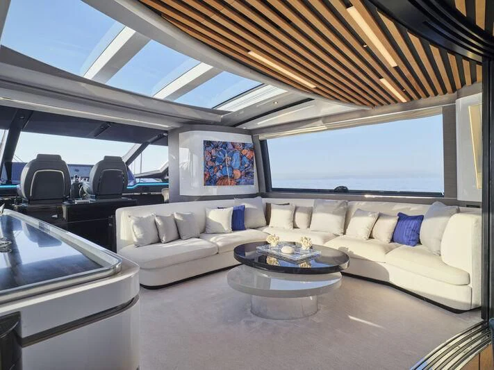 a living room with a couch and a table aboard D FIVE Yacht for Sale