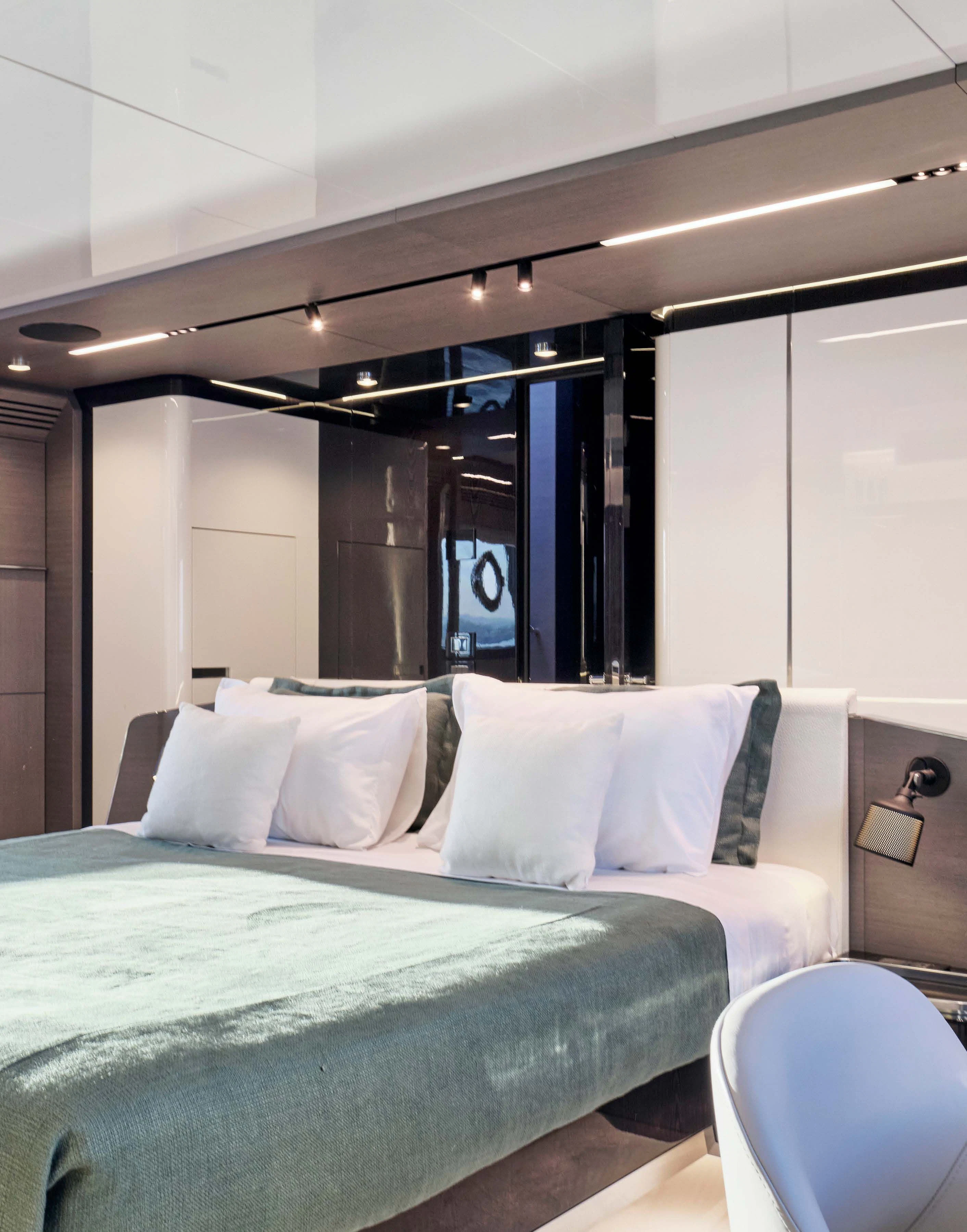 a bed with white sheets aboard D FIVE Yacht for Sale