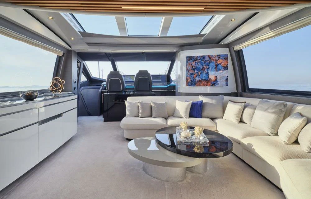 a white car with a table and chairs in it aboard D FIVE Yacht for Sale