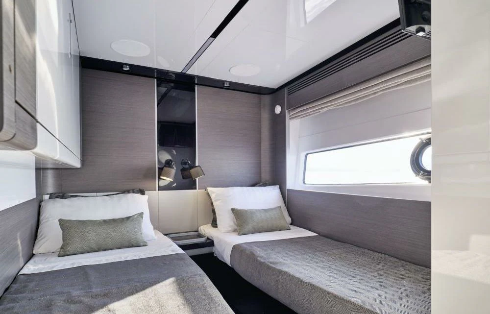 a room with two beds aboard D FIVE Yacht for Sale