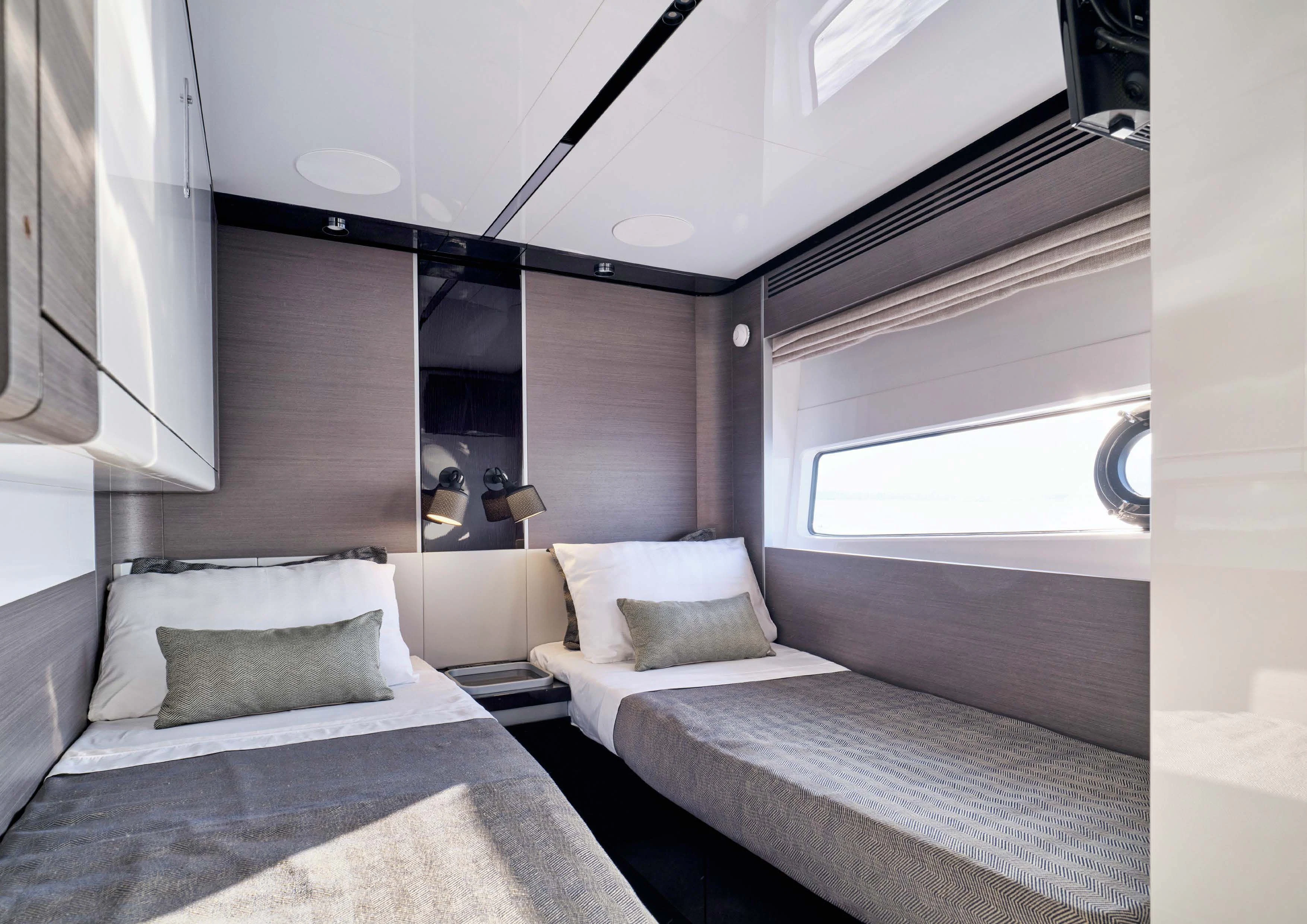 a room with two beds aboard D FIVE Yacht for Sale