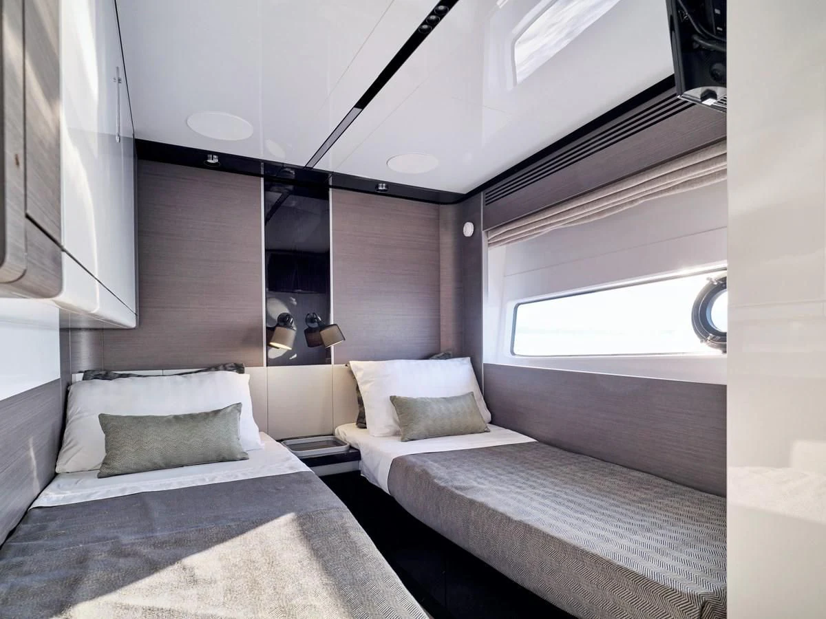 a room with two beds aboard D FIVE Yacht for Sale