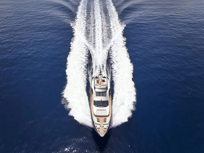 a person wearing a suit and tie aboard D FIVE Yacht for Sale