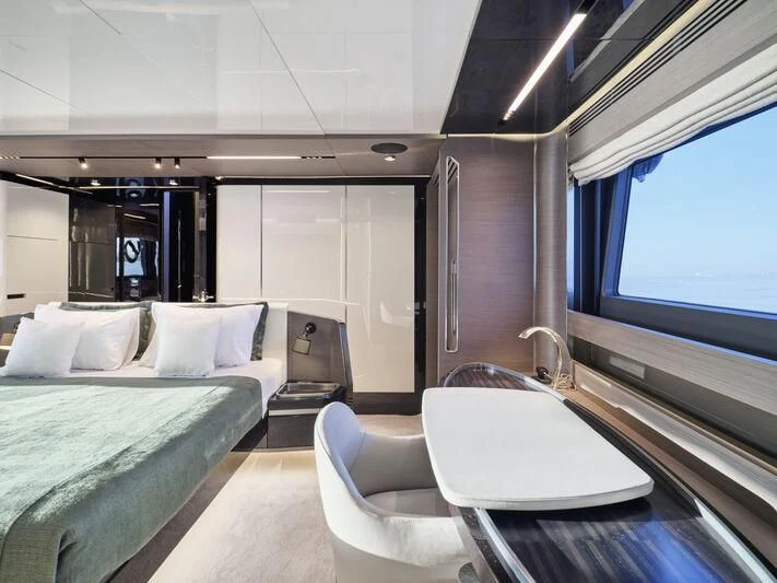 a room with a bed and a desk aboard D FIVE Yacht for Sale