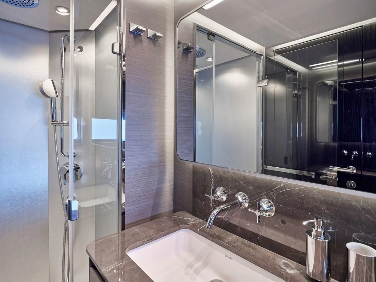 a bathroom with a glass shower aboard D FIVE Yacht for Sale
