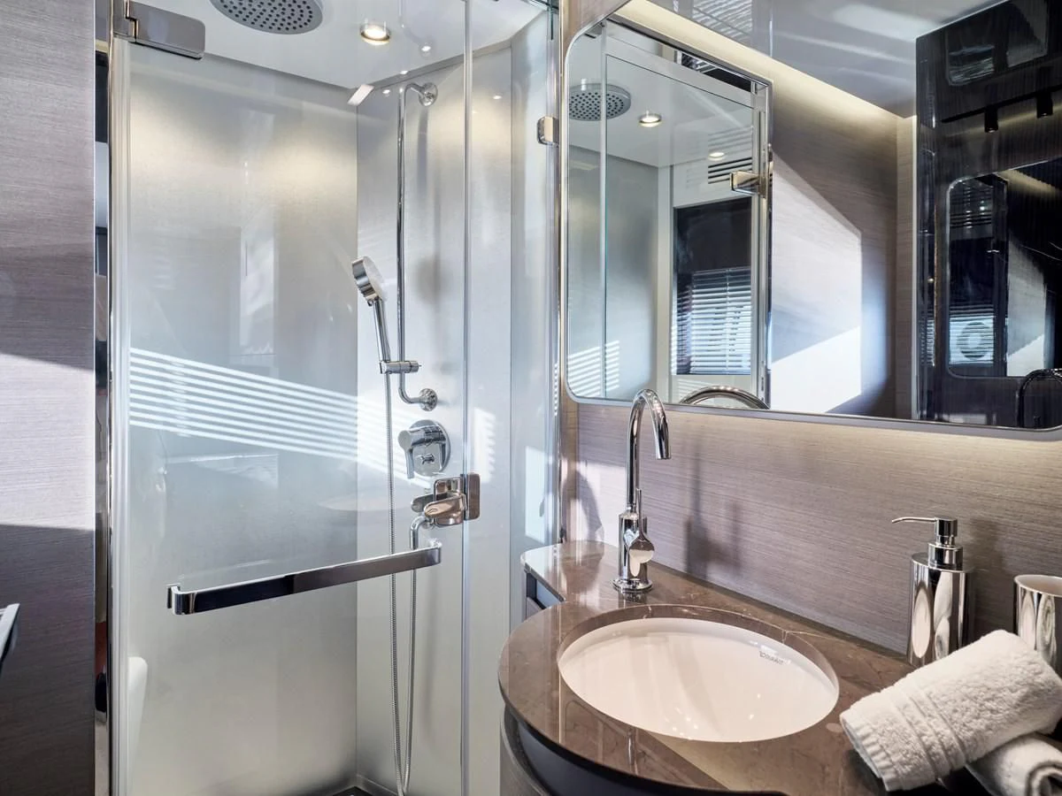 a bathroom with a glass shower aboard D FIVE Yacht for Sale