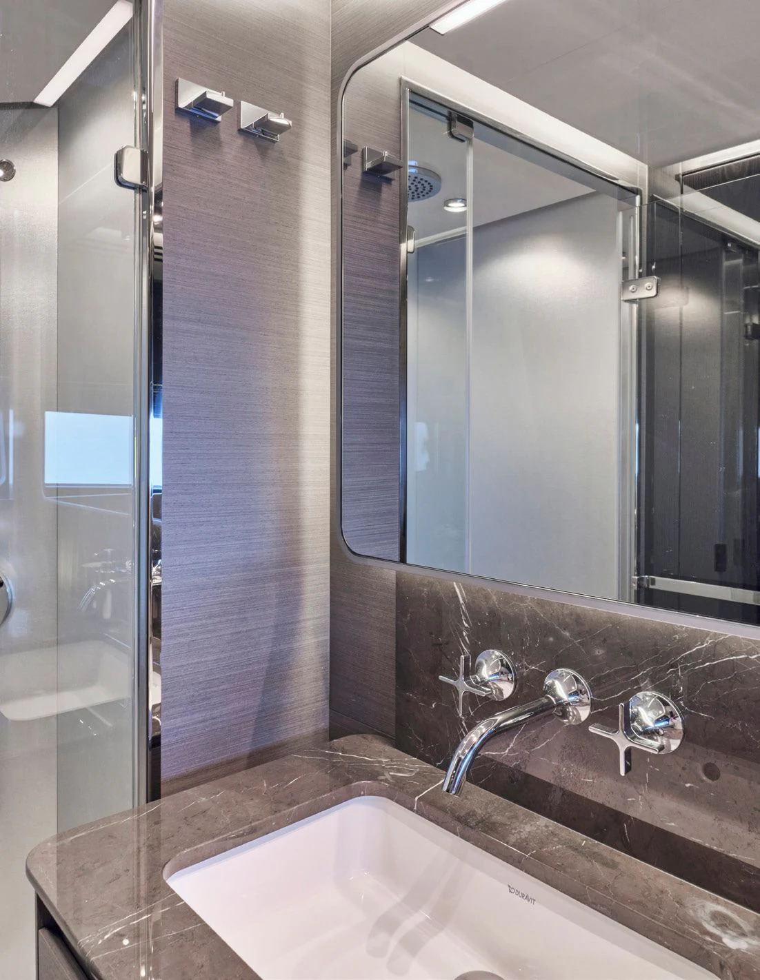 a bathroom with a large mirror aboard D FIVE Yacht for Sale