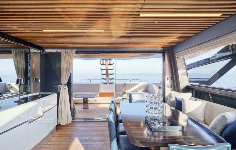 a large room with a table and chairs aboard D FIVE Yacht for Sale