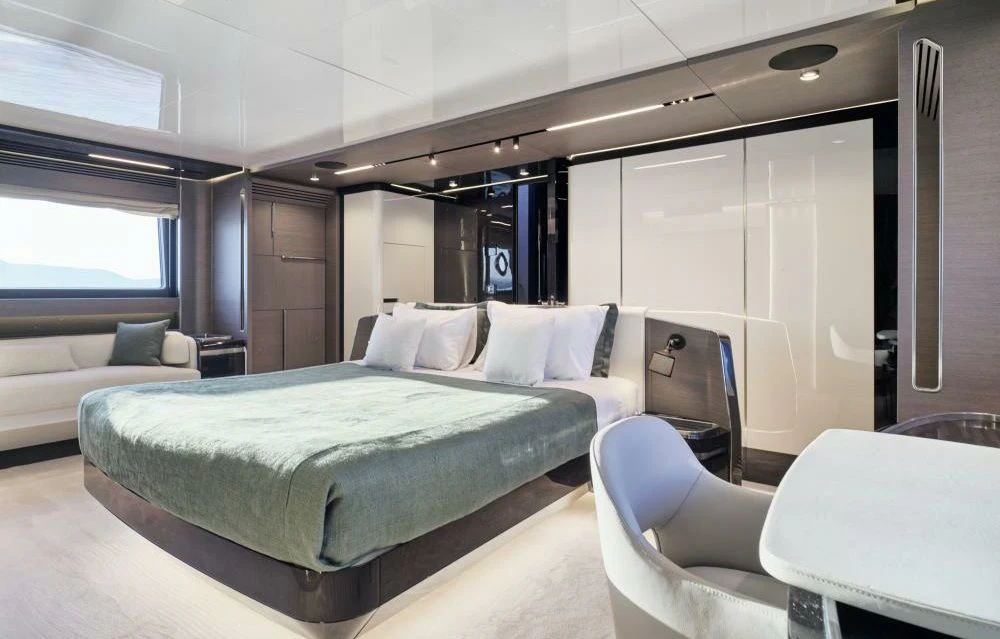 a room with a bed and a desk aboard D FIVE Yacht for Sale